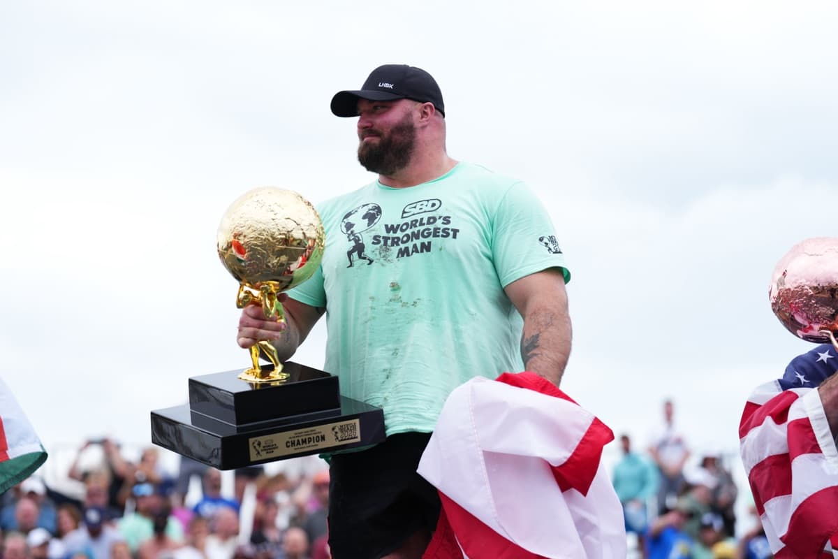 Mitchell Hooper holding the World's Strongest Man champion trophy